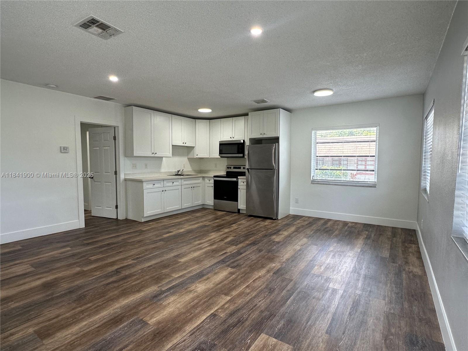 SPACIOUS, stunning and entirely remodeled!! 1-bedroom 1-bath, corner unit apartment in Edgewood - a quiet, charming neighborhood in Ft. Lauderdale. This cute unit is large and BRAND NEW - fully equipped with new lighting, flooring, stainless steel appliances, granite countertops, new cabinets + beautiful kitchen & bathroom finishes. Also features new central AC & impact windows. Water, waste, sewer & maintenance included. Located in a beautiful building with lots of privacy. Area is tranquil, nestled on a quiet street, close to great parks & recreation centers. Gorgeous community and well-maintained property with laundry facilities on-site & private parking for residents. Turn-key gem. A peaceful oasis in an excellent location! Close to major highways, airport, downtown Ft. Lauderdale etc.
