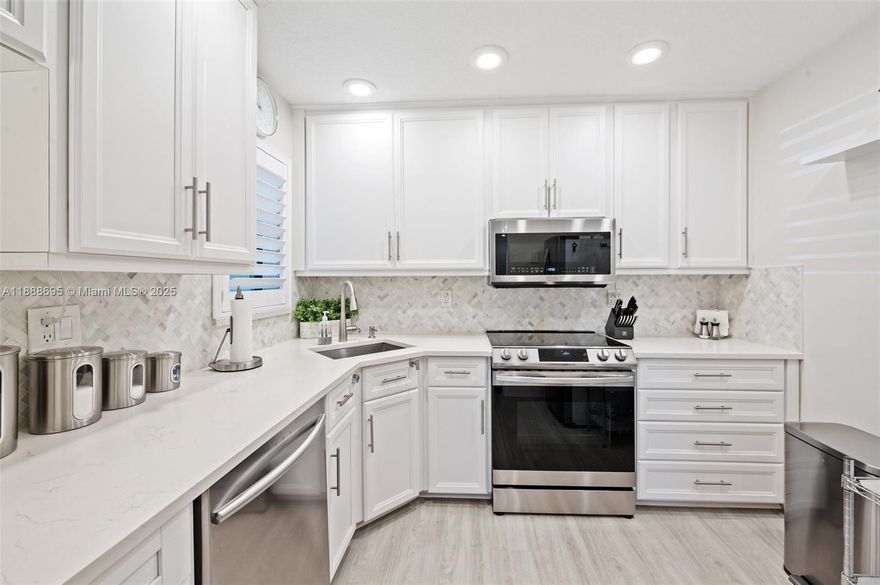 Immaculate and meticulously maintained, this stunning 3-bedroom, 2-bath condo is the epitome of perfection.  WELL-MAINTAINED COMMUNITY - NO ASSESSMENTS. Every detail has been carefully considered, and it shows.  Fully renovated and freshly painted throughout, the space offers a clean, modern, aesthetic with bright, open living areas that feel spacious and inviting.  The kitchen and bathrooms have been thoughtfully renovated with high-quality finishes, and no corner has been left untouched.  From new flooring to contemporary fixtures, everything is designed for both beauty and functionality.  This home is truly turn-key that radiates care and attention to detail. NO MIN DOWN PAYMENT PER ASSOCIATION.