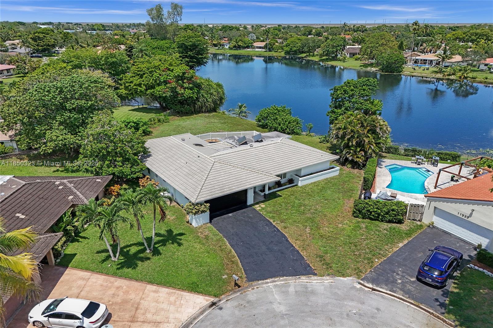 Fully renovated 5-bed, 2-bath pool home in Coral Springs Country Club with no HOA! Situated on an oversized pie-shaped lot at the end of a cul-de-sac with stunning lake views, this large, spacious home is perfect for a big family. Features include a 2-car garage, modern finishes, open living areas, and a covered patio ideal for entertaining. Located in a top-rated school district near parks, tennis, aquatic center, gym, shopping, and dining. Rare turnkey opportunity in a prime neighborhood.