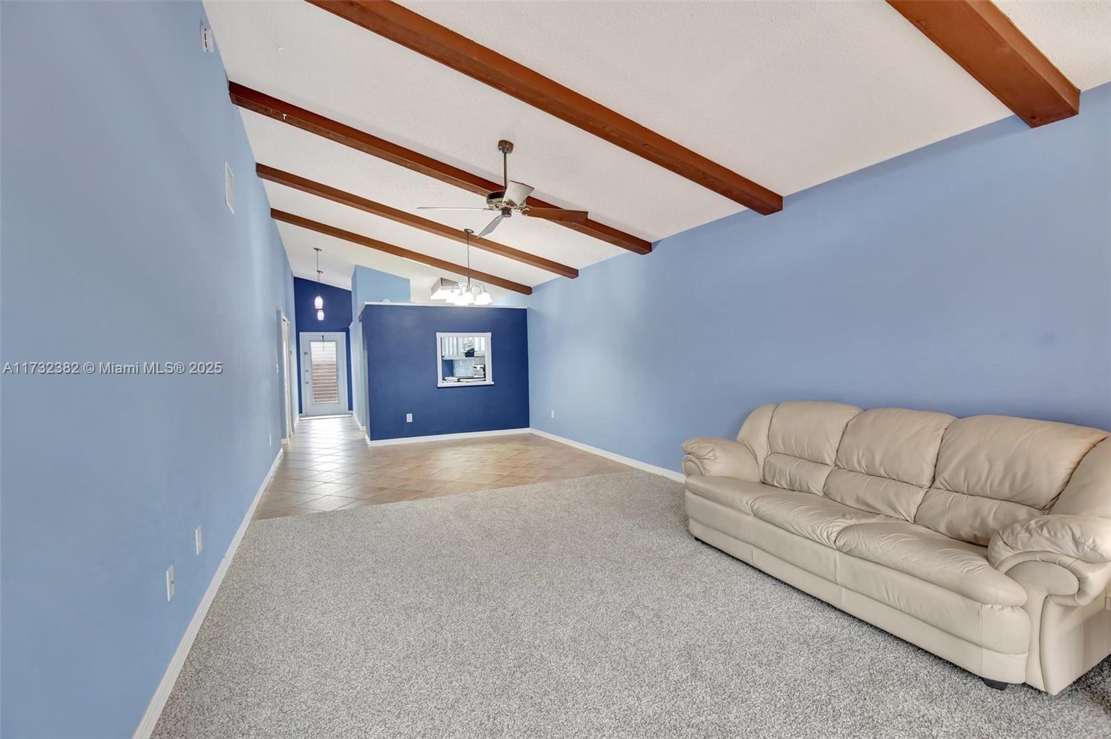 This beautifully updated 2-bedroom, 2-bath villa combines charm and modern style with wood beams and cathedral ceilings. The kitchen shines with custom cabinetry, providing plenty of extra storage, along with a full-size washer and dryer, plus a matching backsplash and countertops. The primary bathroom features a sleek, upgraded shower, while the second bath offers a tub and ample counter space. Both bedrooms are spacious with oversized closets and ceiling fans. Outside, a new wood privacy fence enhances the front, and the large back patio is perfect for entertaining. New roof installed, assessment paid, and storm panels included! All ages Community.
