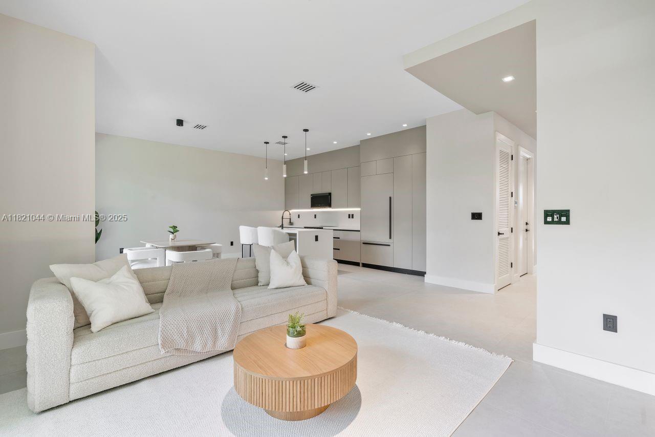 Welcome to the most stunning modern 3bed/2.5bath 2500 s.q. ft gated corner townhome with 2 car garage & private rooftop in all of Coconut Grove. Features include: Coconut Grove Elementary school district, walking distance to CocoWalk, 2014 construction, 2 car garage, huge private roof top w turf grass, large side yard for entertaining, high ceilings & more. Inside features include: custom high-end kitchen & appliances, wide porcelain tile floors, Lutron light switches, custom closets, 1/2 bath downstairs, large master bath suite w/ double vanities & large walk in closet. The second & third bedrooms are spacious with/ large walk in closets & balcony access. Additional laundry room & dedicated office space on the third floor that leads to private rooftop. The Townhouse feels like a house!