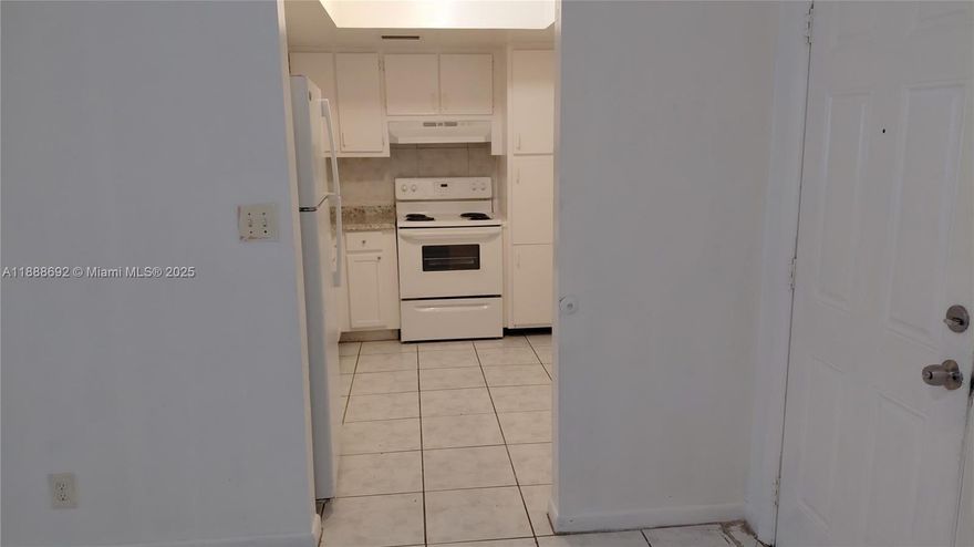 2nd floor unit, all tile floors, plenty of parking.  Complex close to the Turnpike and 441, yet next to parks full of greenery.  Rent OK since 1st year.