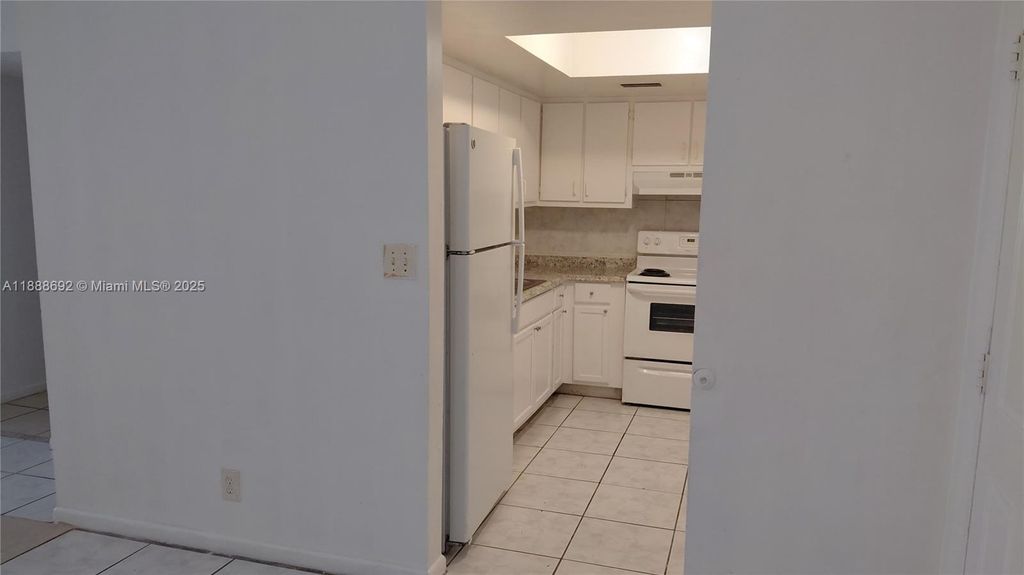 Photo of 1200 SW 50th Ave #210-3, North Lauderdale, FL 33068 (MLS # A11888692)