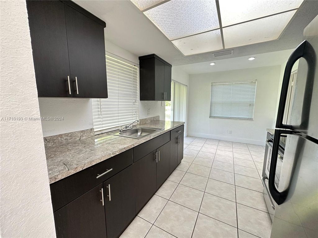 Photo of 2641 NW 47th Ave, Lauderhill, FL 33313 (MLS # A11710193)