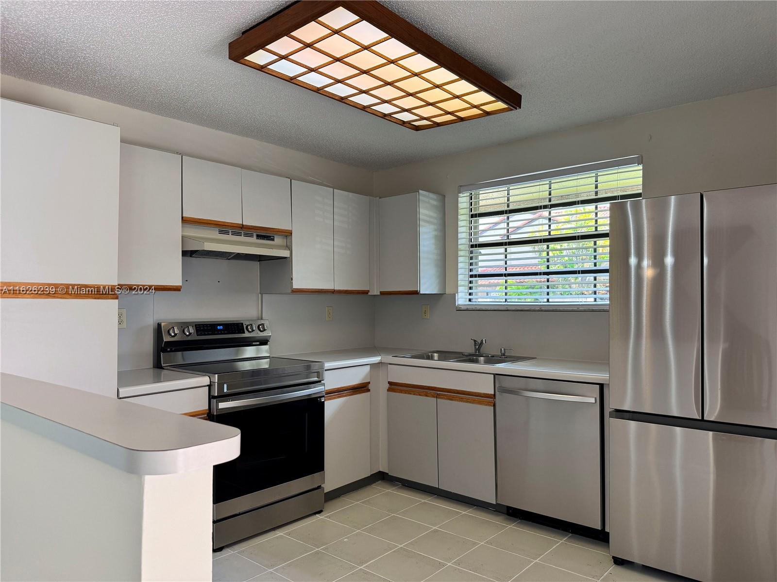 Photo 3 of 75 of 13272 SW 114th Ter 0 townhome
