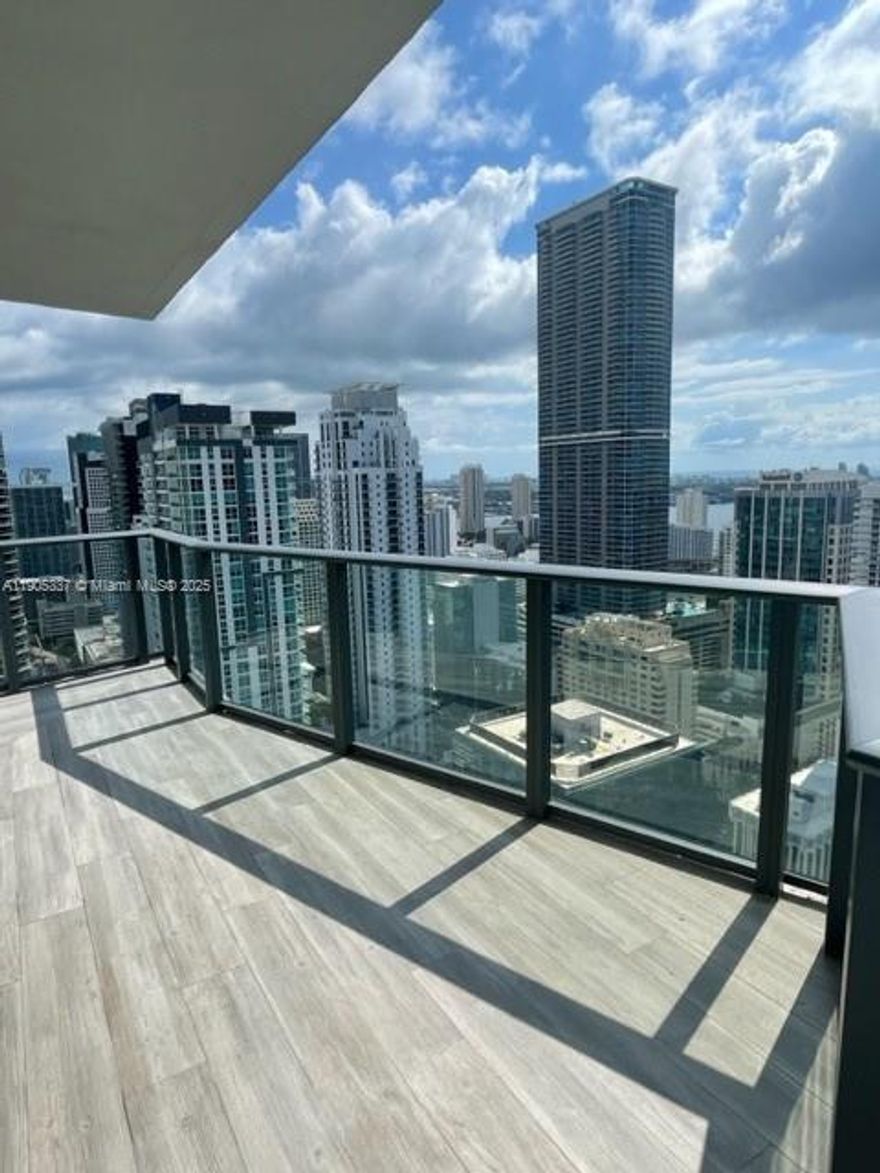 Amazing corner unit in desirable SLS condo! Beautiful skyline and ocean views from this hight floor with large balcony to enjoy it. Unit has 2 bedrooms and 2 full bathrooms plus a den, corner unit with large dinning and living room area, white marble floors, electrical blinds upgrade unit. New Washer/Dryer. Best line at SLS Residence. Association Deposit Required. LIVE IN ONE OF THE MOST SOUGHT AFTER BUILDING IN BRICKELL