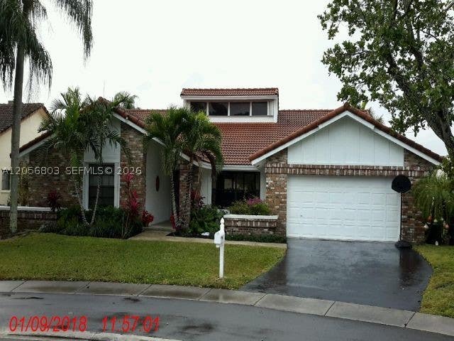 Photo of 1661 NW 100th Way, Plantation, FL 33322 (MLS # A12056803)