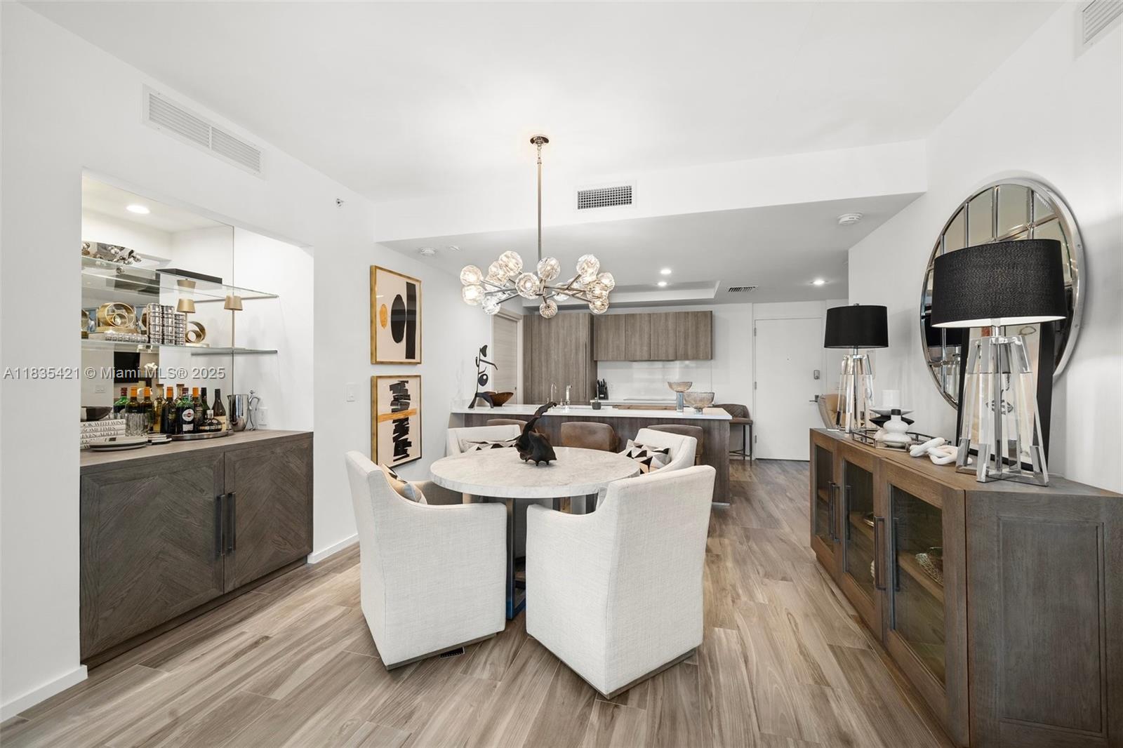 Fully furnished and professionally upgraded by interior designer, this 2BD/2BA + den at SLS Lux offers luxury finishes and upgrades throughout. Features include a private elevator entry, Italian kitchen with quartz countertops, Sub-Zero & Wolf appliances, an incredible walk-in butler’s pantry/laundry room, upgraded closets, marble baths, wood-style porcelain floors, and luxurious designer lighting. Enjoy an expansive balcony with direct views to Brickell City Centre and resort-style amenities: pools, spa, gym, tennis, concierge, and more—all in the heart of Brickell.