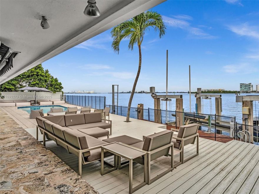 A BOATER'S DREAM LOCATION | SINGLE FAMILY HOME WITH NO HOA'S | UNOBSTRUCTED DIRECT BAY + OCEAN VIEWS | LOCATED @ THE END OF A CUL-DE-SAC | PRIVATE DOCK SPANS 100 FT WITH 40K LB CONCRETE LIFT. This inviting 4-bedroom, 3-bathroom residence boasts a spacious open floor plan flooded with natural light. The modern kitchen features stainless steel appliances and ample counter space, perfect for entertaining. Relax in the beautifully landscaped backyard, capture the views from your heated Salt-Water pool, ideal for outdoor gatherings and weekend barbecues. Conveniently situated in a vibrant neighborhood, this property is close to shops, dining, and parks, offering the best of Miami living. Don’t miss this opportunity to make this your MOVE-IN ready dream home!