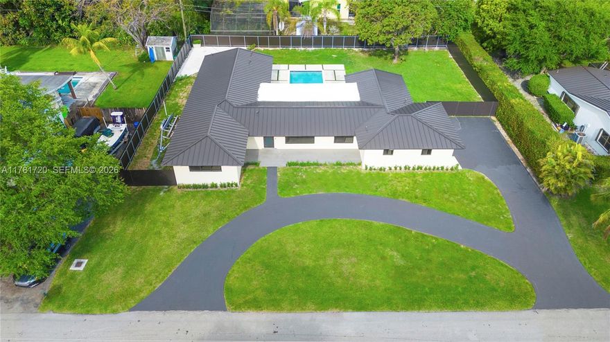 Fall in love with this stunning 4-bed, 3-bath home nestled in the charming and sought-after Palmetto Bay neighborhood. Completely reimagined, this light-filled beauty offers an effortless flow and modern elegance. Enjoy sleek porcelain floors, a gourmet chef’s kitchen with quartz counters, custom cabinets, a wine fridge, and brand-new appliances. The spacious primary suite features a luxurious bath with dual sinks, walk-in closet, and spa-like finishes. Upgrades include a brand-new aluminum roof, impact windows and doors, a 5-ton AC, new washer/dryer, and a beautifully renovated pool with a deck perfect for entertaining—all on a large, fenced-in lot. This is the one you’ve been waiting for!