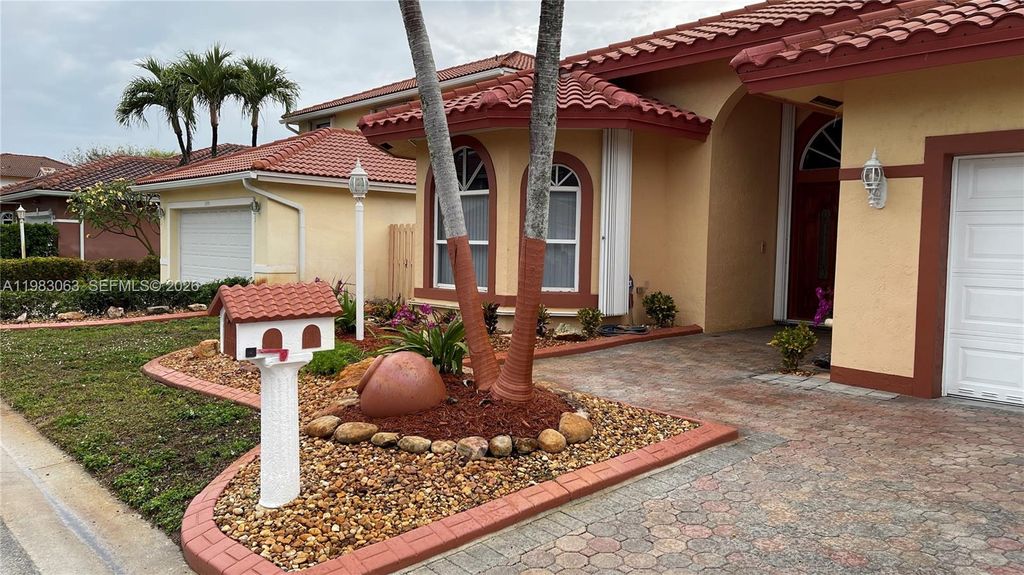 Photo of 11581 SW 10th Ct, Pembroke Pines, FL 33025 (MLS # A11983063)