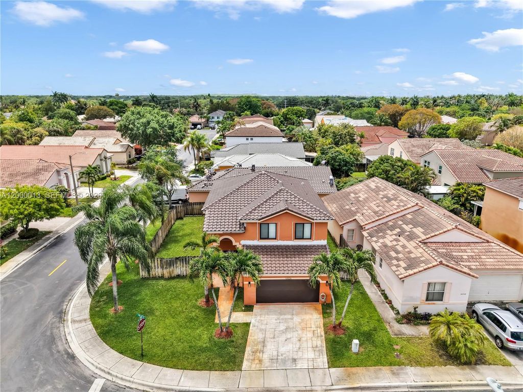 Photo of 10526 SW 14th Ct, Pembroke Pines, FL 33025 (MLS # A12000013)
