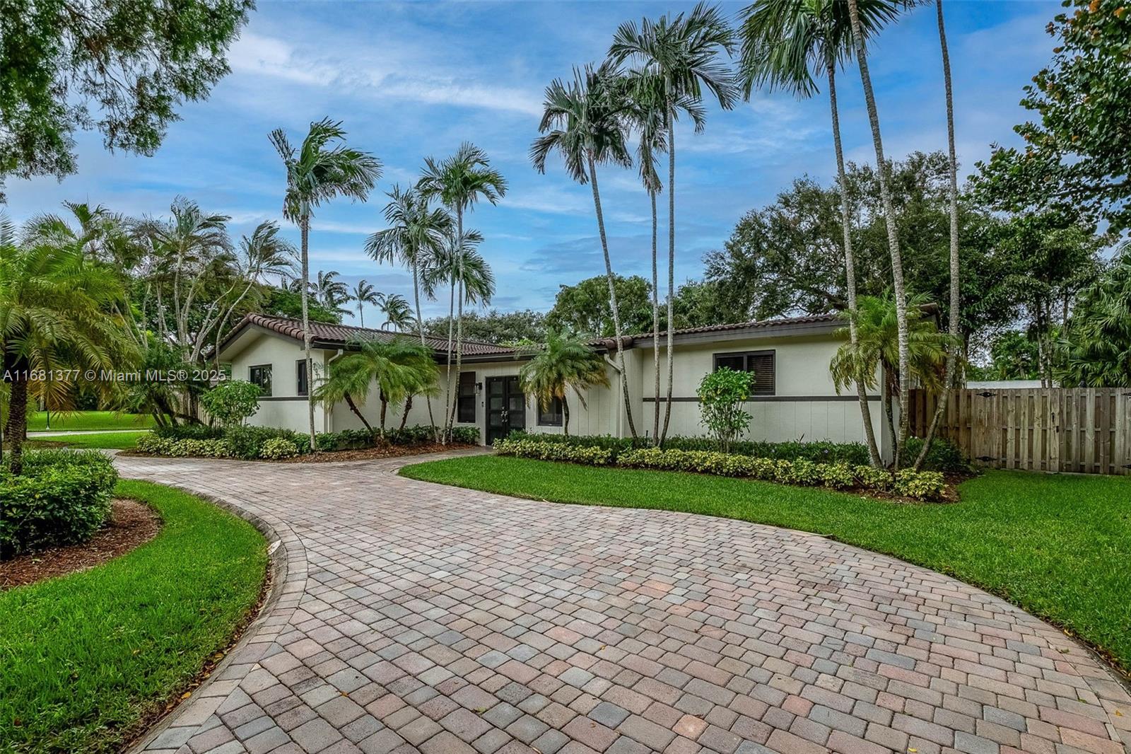 Located on a lovely street in North Pinecrest you will find this wonderful 4 bedroom 2.5 bath home plus den. Welcoming foyer entry opens to large formal living room and family room with vaulted wood ceiling and built-in bookshelves, overlooking the beautiful pool and backyard beyond. Formal dining room opens to kitchen with eat in snack bar, breakfast nook, pantry. Den has a half bath, great for use as an office. Indoor laundry room. Primary suite with French doors leading to the back patio, 3 closets. Nicely sized guest bdrms. Impact windows/ doors. Screened pool, partially covered patio, shed. Fenced corner lot with gated area to park your boat. Circular driveway.