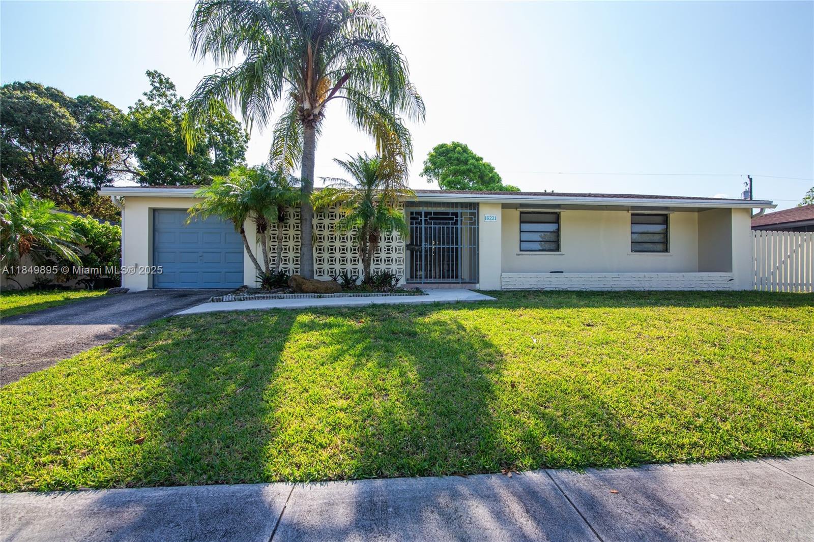 Charming Single-Family Home at the Fairway Park Subdivision! Featuring 4 Bedroom and 2 Bathroom with a 1 Car Garage. Tile flooring throughout the property, spacious living and dining area, spotless and fully equipped kitchen with maple wood cabinetry and laundry room with with space for a full capacity washer and dryer. Enjoy the 7500 SF lot with enclosed terrace and plenty of space for entertainment and privacy. Accordion shutters & No HOA. Property is located only a few minutes away from the Turnpike and US-1, close to schools, shops, entertainment and more. Lawn maintenance is included in the rental payment.