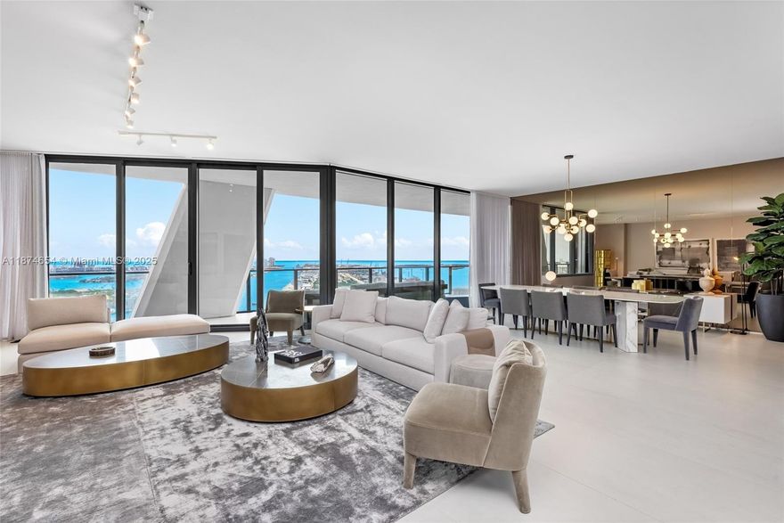 One Thousand Museum by Zaha Hadid Architects is Miami’s most iconic residential tower, offering only 84 private homes with two per floor. Inside, this 4,600 SF half-floor residence commands cinematic views that sweep from Biscayne Bay & the Port of Miami to Miami Beach & the Atlantic Ocean. A private elevator foyer opens to a flow-through layout with 4 bedrooms, 5.5 baths, floor-to-ceiling glass, expansive terraces, custom closets, smart-home technology, & a chef’s kitchen with Gaggenau & Sub-Zero appliances. Enhancements include blackout shades in bedrooms and motorized window treatments throughout. Residents enjoy five-star services & bespoke amenities including 24-hr concierge, a resort-style spa & wellness center, dual pools, & Miami’s only residential rooftop helipad.