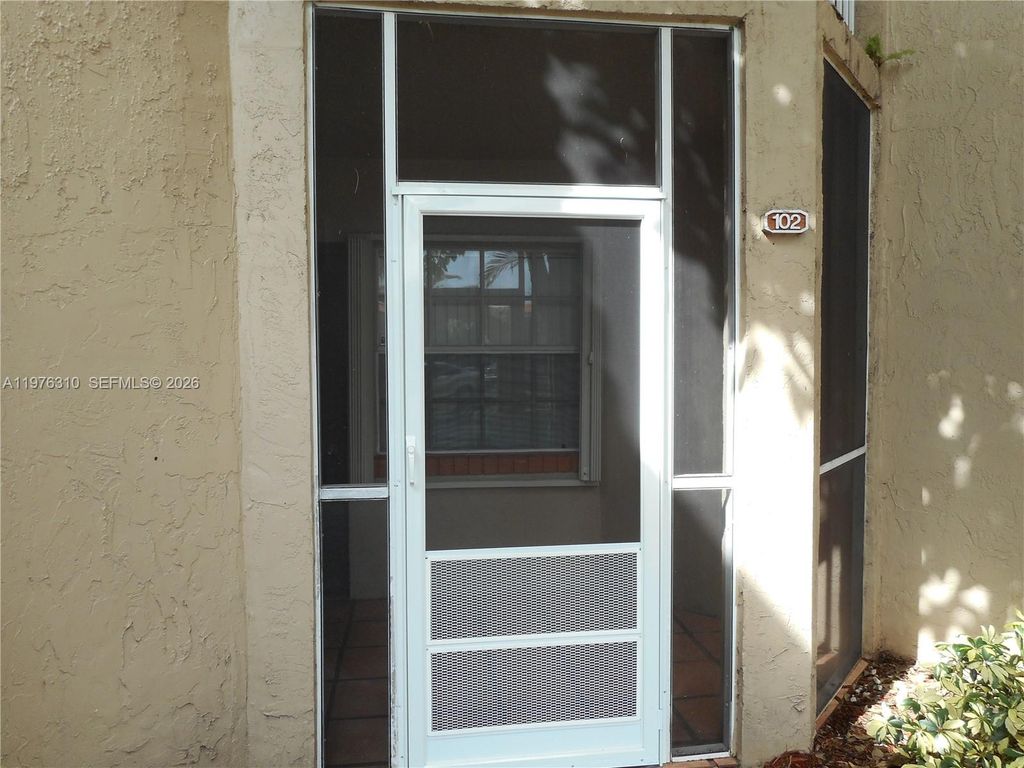 Photo of 301 SW 86th Ave #102, Pembroke Pines, FL 33025 (MLS # A11976310)