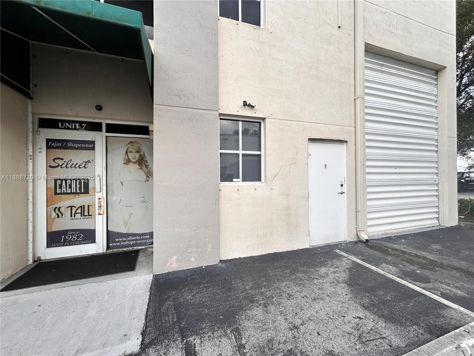 In the heart of Doral condo flex space 1,236 with 360 sq. ft. of office spaces (3) and bathroom with a mezzanine. Front door, plus gate to the warehouse. 3 parking spots in front of the unit plus available parking in the visitors area. The whole unit is under a 2-year old A/C unit, including the warehouse area. Very low condo due maintenance. This is a very rare opportunity. Shelving and AC unit are not included with the sale.
