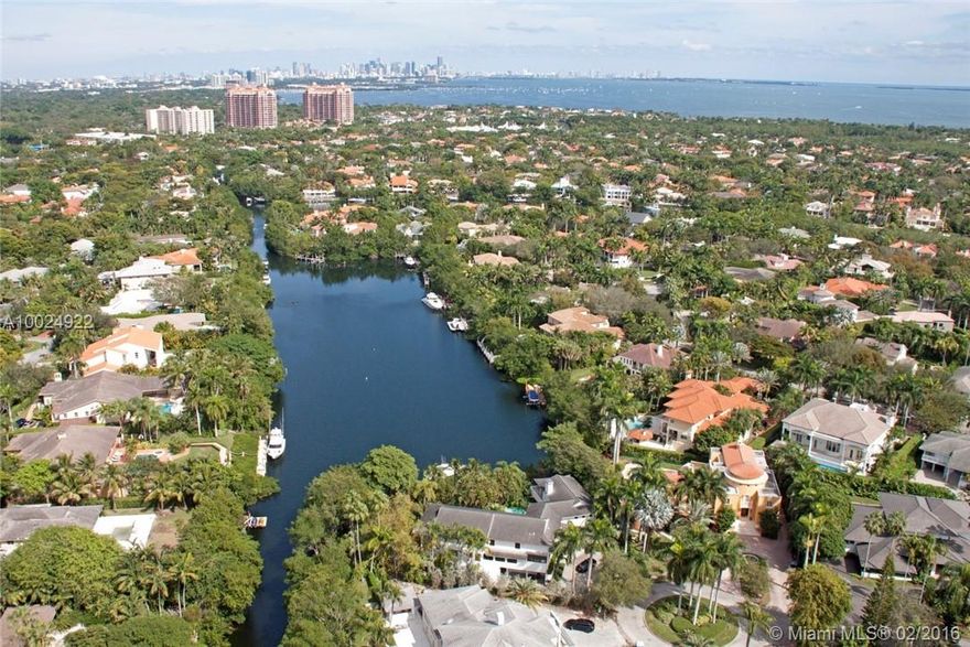 Enjoy unparalleled long views of wide water LagoMinore from lrg yard,terrace/balconies & walls of glass of this Tropical Contemporary designed to max views,sitting high on oversized 22,050sf lot, over 210 ft WF,80 ft dock.Open living spaces w/high ceilings surround lagoon pool framed by view.2/3/1 dwnstrs.Floating staircase to private master w/best view in house from  balcony+ sitting area w/walls of glass. 2/2 wing w/study/play area/loft.Updates/some impact/generator.Bonus rec/wine/bar.Sf from ins meas*