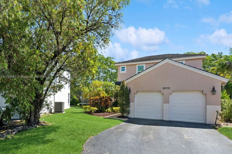 Discover this beautifully upgraded 3-bedroom, 2-bathroom home in the desirable Chapel Trail community of Pembroke Pines. Situated on the largest lot in the neighborhood, this residence features a spacious 2-car garage with epoxy flooring, impact windows and doors, and sleek aluminum stair rails. Inside, enjoy elegant crown molding, durable laminate flooring, and a modern kitchen with all-new appliances and soft-close cabinetry. The home includes a tankless water heater and a brand-new A/C unit for year-round comfort. Step outside to a private exterior deck surrounded by lush mango trees—perfect for relaxing or entertaining