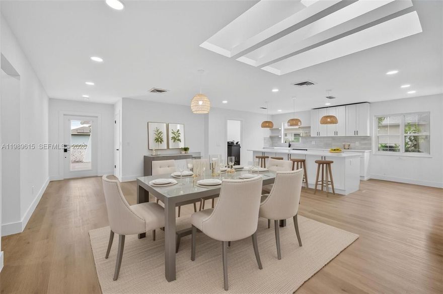 Featuring a NEW ROOF, brand new impact windows (paid for and being installed), impact skylights, impact sliding doors, new water heater (2025), and HVAC system (2019), this move-in-ready 4-bedroom, 2-bath pool home offers immediate comfort and peace of mind with no HOA. Thoughtfully remodeled throughout, the interior showcases wide-plank luxury vinyl flooring and a versatile laundry room designed for everyday ease. The centerpiece is a stunning designer kitchen with quartz countertops, shaker cabinetry, Samsung appliances, and an expansive 110-inch island perfect for entertaining and daily living. Step outside to a private backyard retreat featuring a saltwater pool with a new skimmer, ideal for relaxing and enjoying Florida living year-round. Located in South Port, this home blends modern upgrades, style, and functionality.