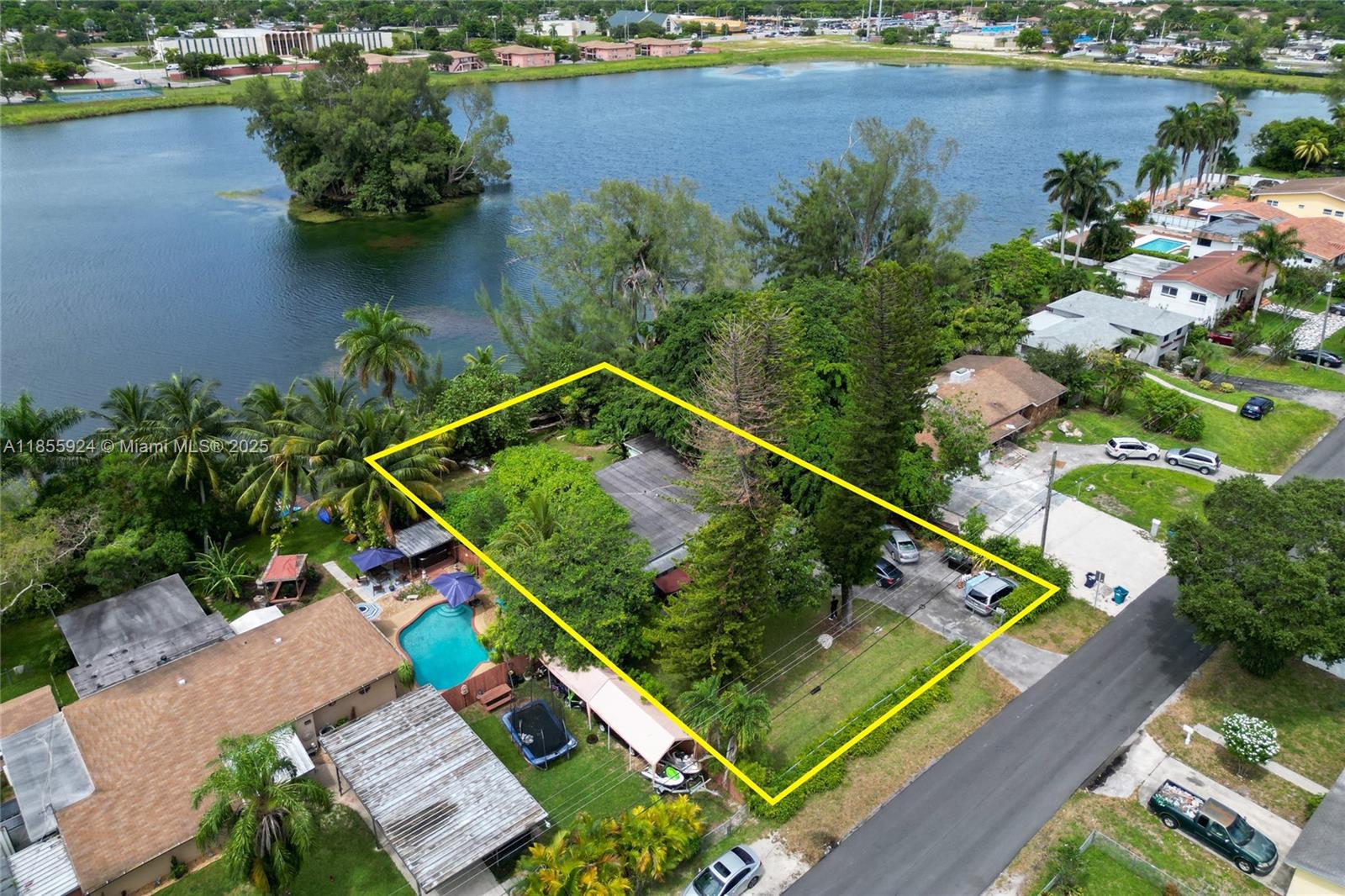 This diamond-in-the-rough offers over 1,700 sqft of living space ready for a full remodel — the perfect canvas to create your dream custom home or an exciting investment project. Situated on a large 15,000 sqft lot, this property boasts direct waterfront access to a serene lake, ideal for fishing, kayaking, and peaceful recreation right from your backyard. With endless possibilities to modernize and expand, this home is a prime opportunity to design and build your ideal lifestyle in a great location - minutes away from Amelia Earhart Park, an Amazon Mega Warehouse, and Opa-Locka Executive Airport. Don’t miss your chance to own a waterfront property with significant upside potential. Bring your vision and tools—this one is priced to sell and ready for transformation!