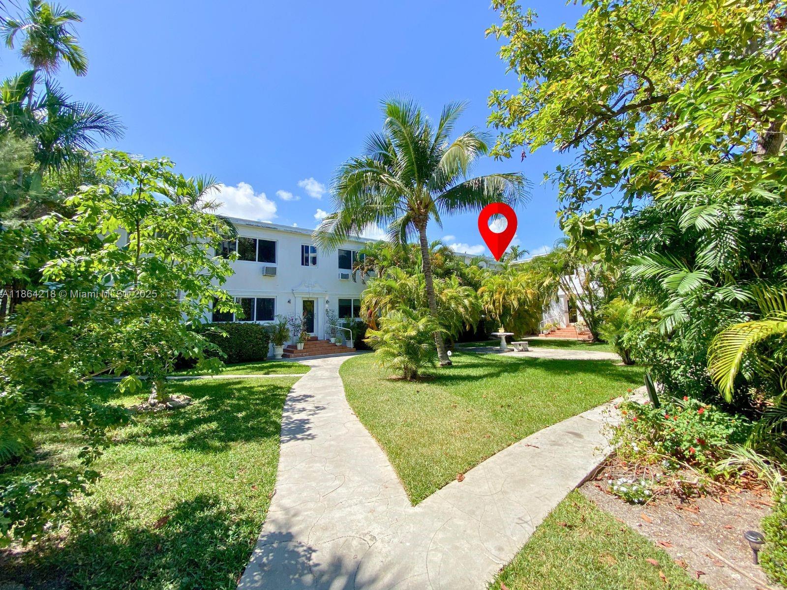 Experience bright garden views in this charming, partially furnished 2-bed, 1-bath at Anthony Gardens, Bay Harbor Islands. Each spacious bedroom features a comfortable queen bed. This move-in ready home offers an open layout, updated flooring, newer AC, and full impact windows, filling the space with natural light. Enjoy on-site laundry, assigned parking, and peaceful sitting areas. Steps from Ruth K. Broad K-8 Center, and just a short walk to Bal Harbour Shops, beautiful beaches, restaurants, and grocery stores. Embrace the Bay Harbor Islands lifestyle in a secure, well-maintained building with lush landscaping. Very easy to show, schedule your visit today.