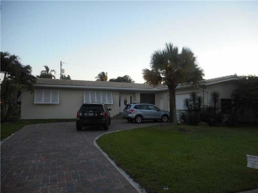 Best location in the "Bird" section. No front neighbors. Dual alley entry helps you park your boat in the backyard. Home meticulously kept over the years. Two and half car garage. Recent paved driveway and travertine pool deck . A Must see.