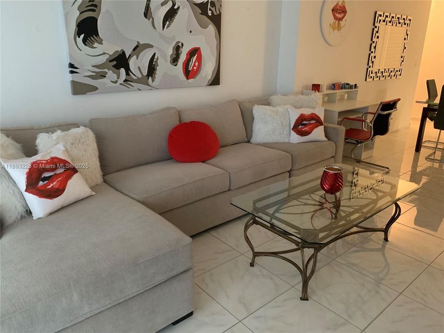 Beautiful and spacious unit on the beach! This unit is furnished, and has everything you need for your stay. Conveniently located close to shopping centers, this community offers a wide array of amenities for you to enjoy: restaurants, convenience stores, pools, tennis courts, gym, too many to mention. Come and see for yourself. Rent includes water, basic cable and internet.