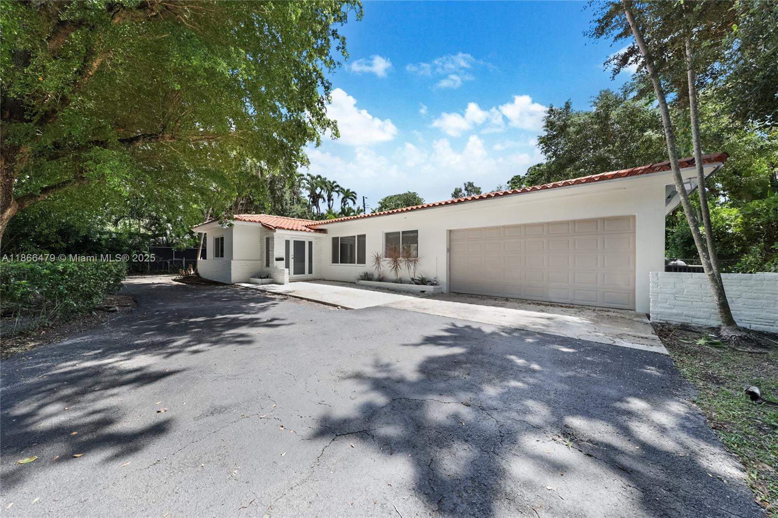 Stylish light filled Coral Gables single family residence with huge sparkling Saltwater private pool. ALL impact windows & doors throughout. Large chefs' kitchen with granite tile counter tops. Gorgeous inlaid marble floors, offering 2 bedrooms & 1 bath (Main House) with 1 full "cabana" bath accessed via an oversized 2 car garage. Situated on a rare, large & lush 10,500 sqft lot with great parking, & coveted circular driveway on the south side of Bird Road. Newer A/C freshly painted in & out. Ready for immediate occupancy. Experience the prestige of the City Beautiful, with the convenience of location. Steps from shopping & countless dining selections.