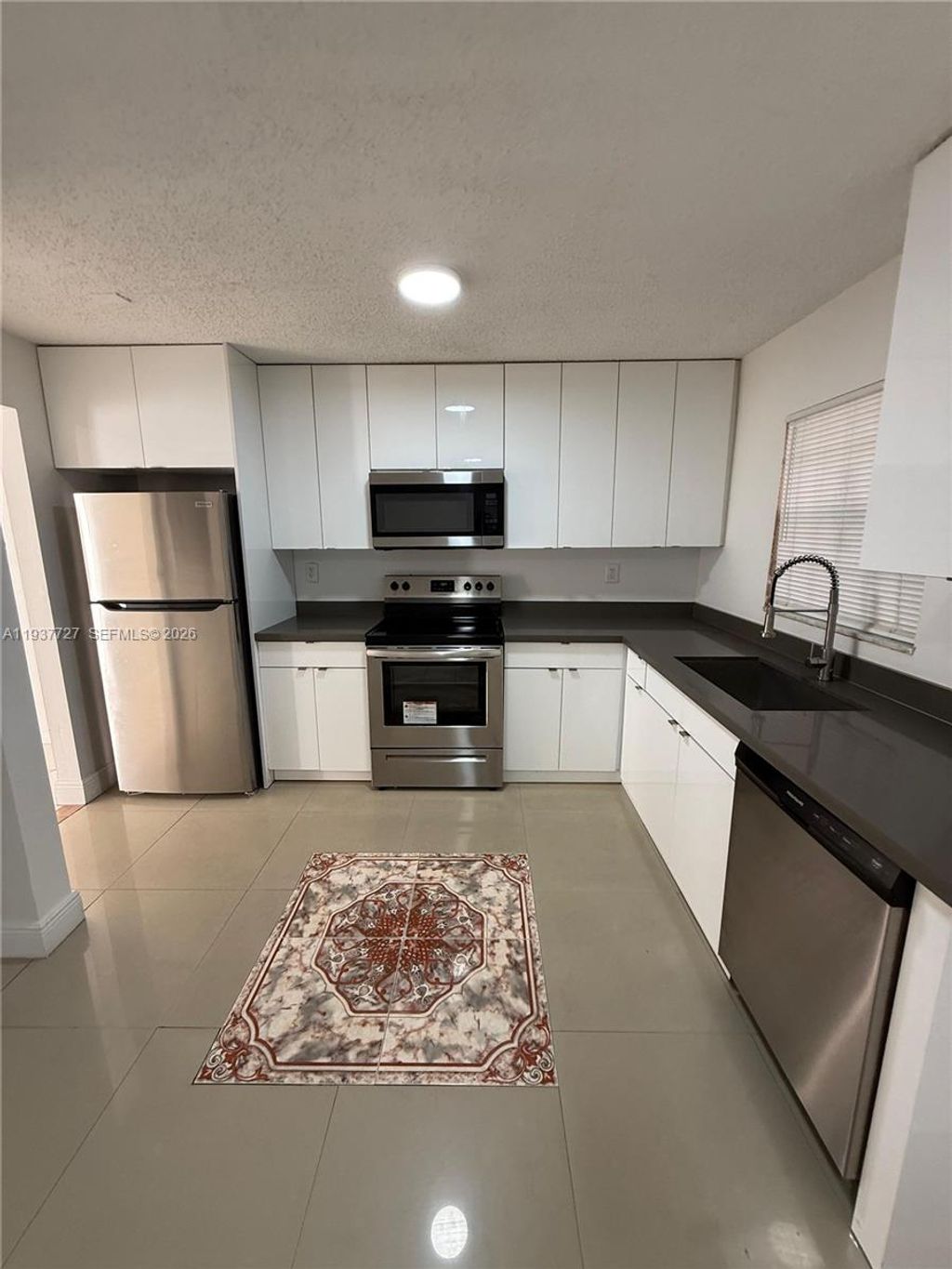 Photo of 5817 Blueberry Ct #92, Lauderhill, FL 33313 (MLS # A11937727)