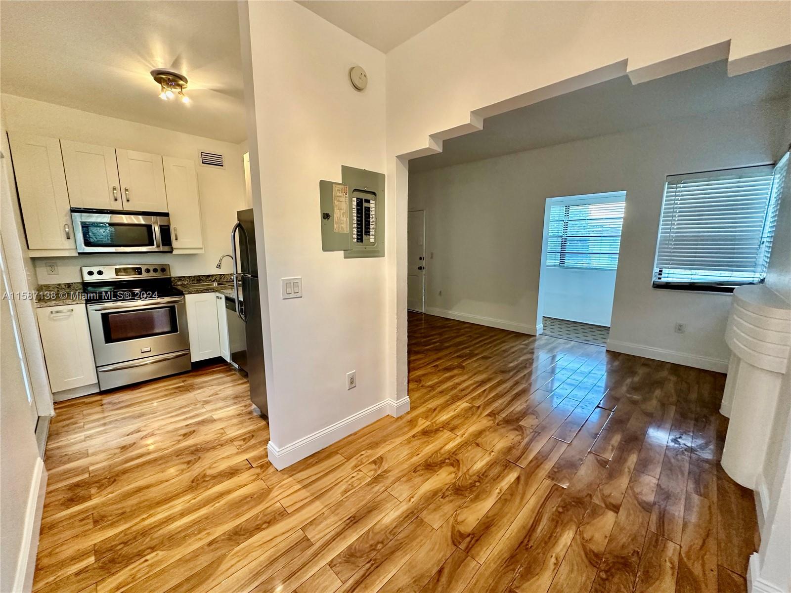 Discover a charming two-bedroom unit situated on the ground floor, featuring wood flooring and abundant natural light. Water is included, along with access to a communal patio area. Benefit from no HOA fees and swift approval processes. This home is move-in ready—seize this opportunity now.