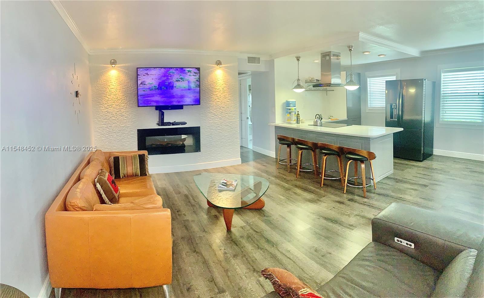 Come see this Gem, Can show at any time 7 Days a week owner or agent available!. Turn Key 2 Bedrooms, 1-1 1/2 Baths with Unobstructed Lake Views at Century Village Boca. Completely Updated, 2021 AC with & 2021 Water Heater. New Kitchen with Quartz Countertops, LG Stove, Fridge, with over Hood, New Floors, Freshly Painted, Updated Doors and Trim, Updated Bathrooms with European Style and More. All of the owner's beautiful contemporary furniture throughout the unit, living set, TV set with Bose system, adjustable bed frame set, etc. can be purchase. The community offers a full clubhouse with access to a movie theater, events, heated pool, sauna, fully equipped gym, tennis court, transportation, gated community,etc. can rent after 1 year. Seller to Buyer Incentives considered on condo fees.