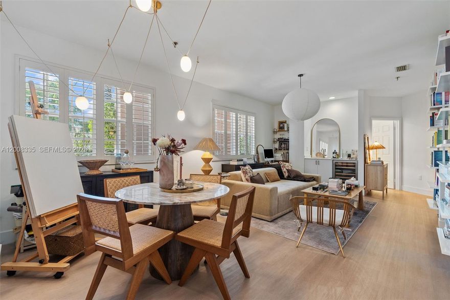 Beautifully renovated 1 bedroom, 1 full bath plus 1/2 bath residence in an elegant Coral Gables building steps away from Miracle Mile. This light filled home features high ceilings and a thoughtfully designed open layout with a custom kitchen showcasing Calacatta Michelangelo dolomite countertops and backsplash, open shelving, designer hardware, and a premium Fisher & Paykel appliance package. Additional highlights include a wet bar with wine refrigerator, Delta faucets throughout, Nest thermostat, and a Cloud water filtration system with dedicated tap. The spacious living and dining areas flow seamlessly for entertaining. The serene bedroom offers a custom walk in closet and a chic en suite bath. Impact windows with shutters, refined finishes, and warm wood flooring throughout. Additional storage space in the garage. Enjoy resort style amenities including pool, sauna, and BBQ area. Prime location close to shops, dining, parks, and cultural attractions. A truly special turnkey opportunity.
