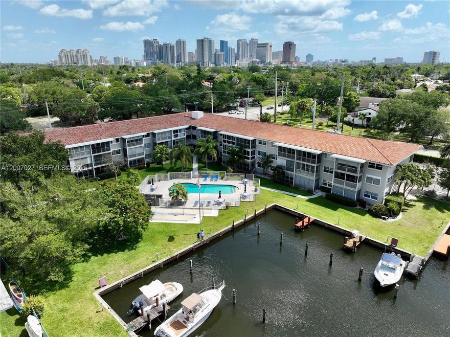 Private boat dock! 2 BD | 2 BTH waterfront residence in a gated community, positioned on one of Fort Lauderdale’s widest ocean-access canals with no fixed bridges. This first-floor unit offers a bright, open layout with seamless living spaces and tranquil views of the pool, expansive green space, and passing boats. New roof. Best covered parking plus ample guest parking. Ideally located just minutes from Las Olas Blvd, downtown Fort Lauderdale, world-class beaches, major highways, and Fort Lauderdale International Airport. No special assessments and no age restrictions. Well-maintained community with pool and BBQ area; pets allowed. Ideal for seasonal or full-time living. No rentals permitted. Unique opportunity to acquire two side-by-side units—owner is also offering Unit 110, both units have beautiful views. A rare waterfront offering in a premier location.