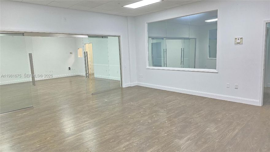 Excellent office opportunity located in the highly desirable Doral business district. This property consists of two connected units offering a functional layout that combines private offices with an open bullpen workspace, ideal for a variety of professional or administrative uses.

The space features impact glass windows providing natural light, acoustical drop ceiling at approximately 9 feet, and a dry kitchenette area for staff convenience. The layout supports collaborative work environments while maintaining private office areas for meetings or management use.

Located on the same floor as the building’s common conference rooms, the unit offers added convenience for professional meetings and business operations. The space also includes separate thermostat control and a separate electric meter.

Seven assigned parking spaces are included, providing convenient access for staff and visitors. The property is situated within a modern professional building in Doral, surrounded by established businesses, dining options, and major transportation corridors, making it a strategic location for companies seeking accessibility and a strong business environment.