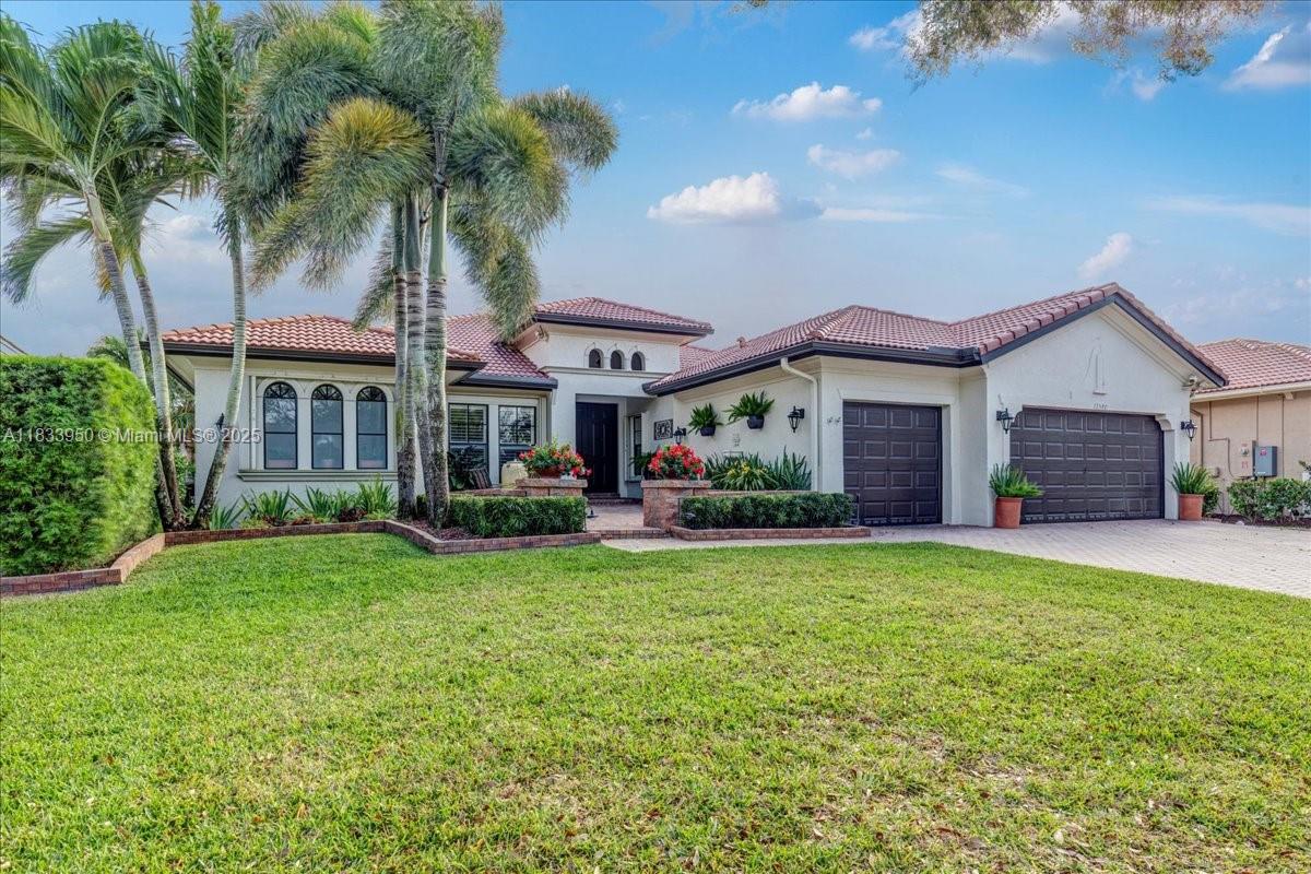 WATERFRONT PROPERTY – Best price in prestigious Heron Bay! This one-story home sits on a 10,537 sq ft lot and offers 4 bedrooms plus a extra room currently used as an oversized walk-in pantry — perfect for a home office, hobby room, or future flex space. Updated open kitchen, 3 full baths, and spacious living areas. Enjoy a screened patio with pergola and spectacular, serene canal views. PLENTY OF ROOM FOR A POOL – PROPERTY LINE EXTENDS 16 FT BEYOND THE SCREEN. 3-car garage + driveway fits up to 9 cars. Resort-style community with 2 clubhouses, tennis, pickleball, gym, playground, waterpark, A+ schools, gated access, and more!
