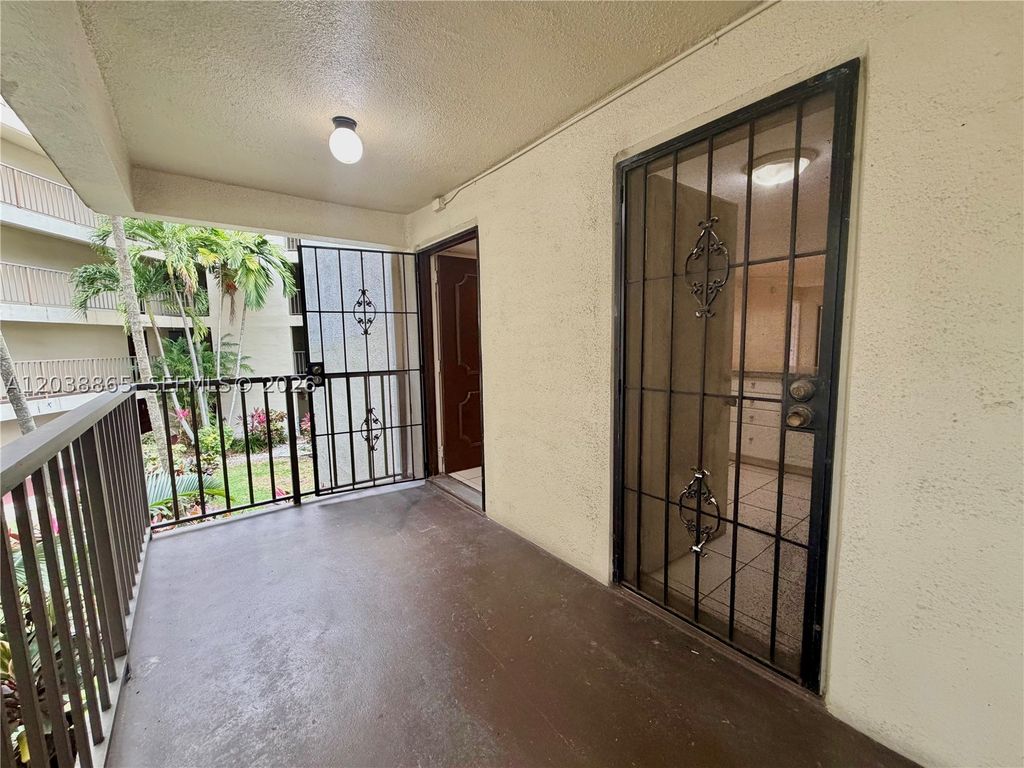 Photo of 2320 S Cypress Bend Dr #206, Pompano Beach, FL 33069 (MLS # A12038865)