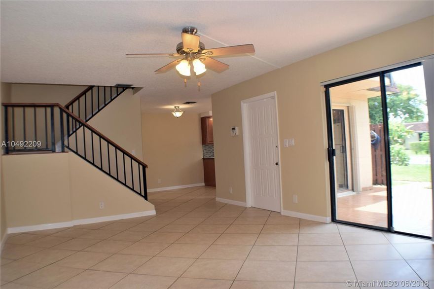 Beautiful 2 story villa in Tamarac, FL at Villas of Woodland Greens. This 2 bedroom and 2.5 bath designed with a great open space concept, updated with new floor tiles and hardwood floors, plenty of storage space, new washer and dryer, with scenic pond views from both bedrooms, fenced patio and hurricane shutters. It has ample assigned parking spaces and plenty of guest parking. Low monthly Association maintenance fee.