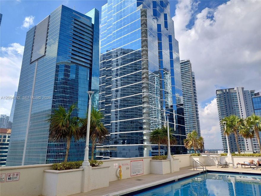 This stunning condo at The Club is immaculately maintained and boasts light-colored wood floors throughout. Featuring a granite countertop and washer/dryer, the owner has just completed appliance upgrades. Enjoy the spacious oversized balcony with lovely views. The Club offers exceptional amenities including a fully equipped gym, two swimming pools, a hot tub, and sauna, more than other complexes in the area. Located in the heart of Brickell, it's just minutes away from shopping, restaurants, and corporate offices. Scheduling a showing is super easy, simply call the listing agent!