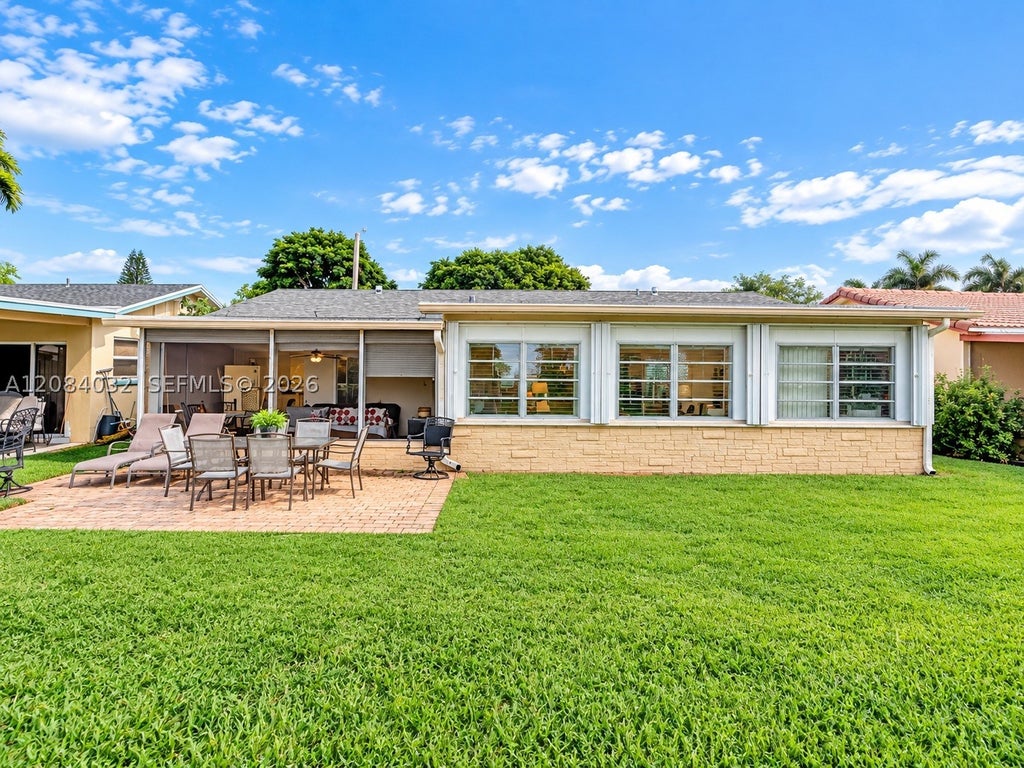 Photo of 4719 NW 44th Ct, Tamarac, FL 33319 (MLS # A12084032)