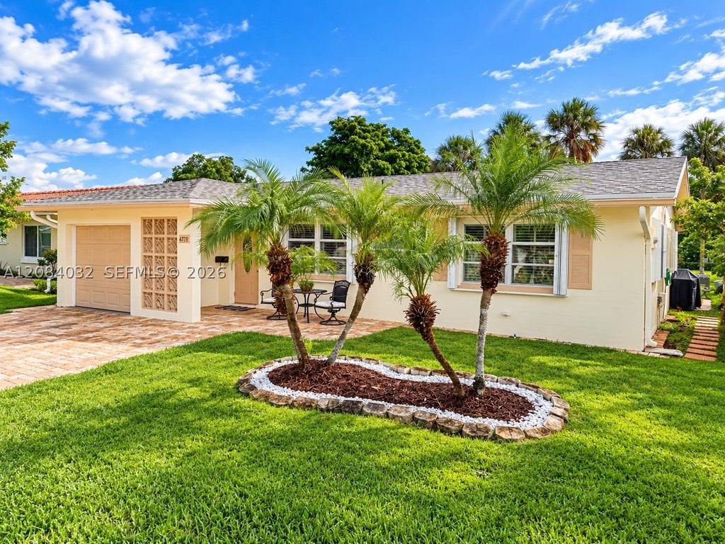 Photo of 4719 NW 44th Ct, Tamarac, FL 33319 (MLS # A12084032)
