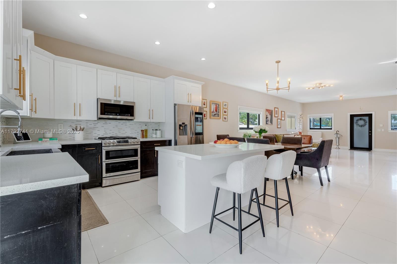 Experience luxury living in this beautifully rebuilt 2018 Miami home, featuring impact windows, four bedrooms, and three designer bathrooms, including two elegant master suites. The open-concept layout highlights a gourmet kitchen with premium stainless steel appliances, a gas stove with griddle, electric stove, and chef’s sink. Relax in a spa-style bath with a whirlpool tub and floating vanity. The expansive backyard offers space for a custom pool and BBQ area. Prime location near Nicklaus Children’s Hospital and Coral Gables. A true must-see! SELLER OFFERING CREDIT AT CLOSING TOWARD BUYER’S CLOSING COSTS.