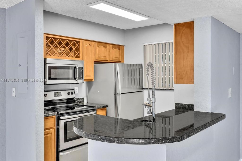 Photo of 2810 N Oakland Forest Dr #204, Oakland Park, FL 33309 (MLS # A11973494)