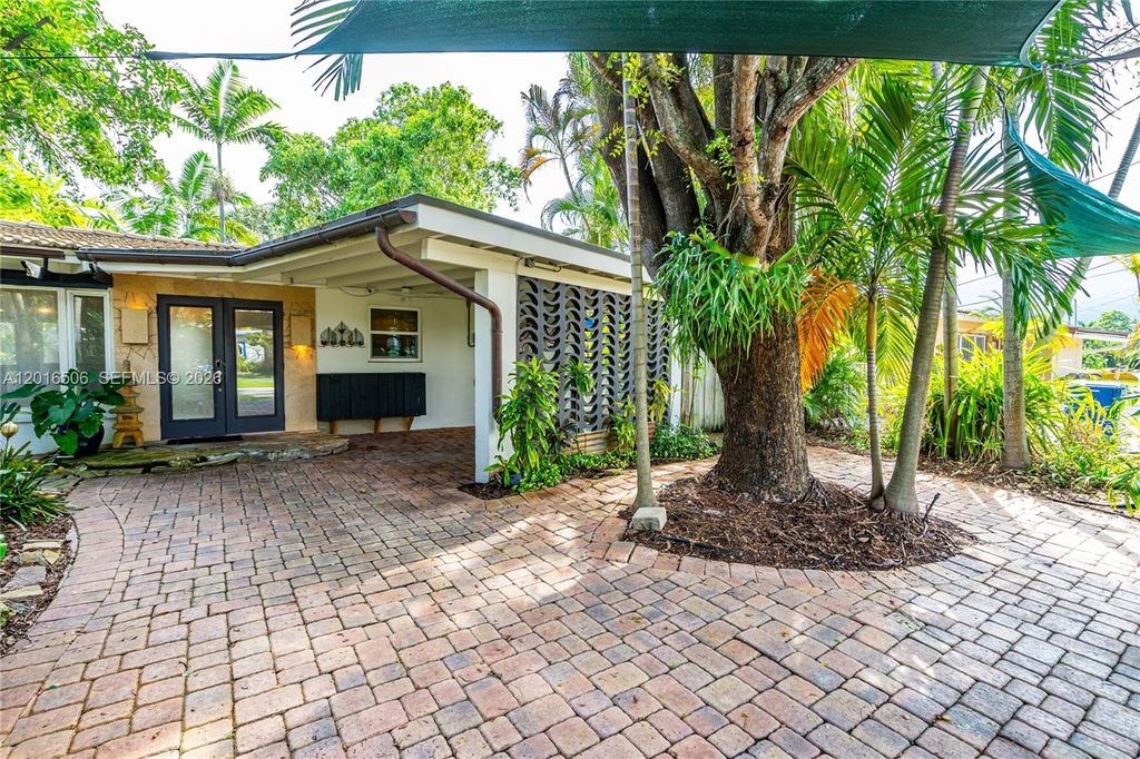 Photo of 1930 NW 32nd Ct, Oakland Park, FL 33309 (MLS # A12016506)