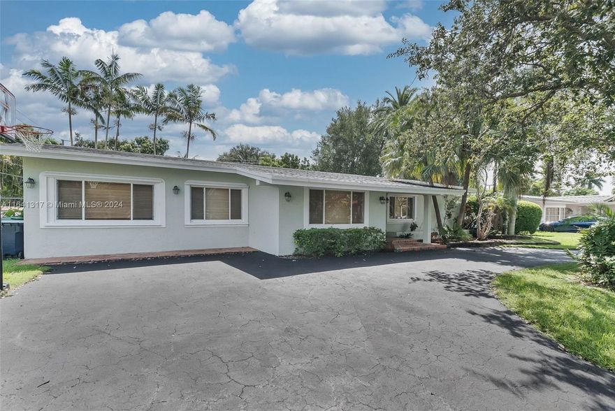 Wonderful 4 bedroom/ 2.5 bath home in Palmetto Bay.  Welcoming double door entry with foyer. Formal living and dining rooms plus sunroom/office. Take in the beautiful backyard views from the kitchen with breakfast nook, center island with sink & cooktop plus pantry which opens to the family room perfect for relaxing with family and friends. Great primary suite w/ French doors leading to the backyard. Large primary bath incl. dressing area/walk in closet. Split bedroom plan with the 4th guest bedroom off living area, perfect for guests. Tile flooring and some carpet in the bedrooms. Indoor laundry room. Partial impact doors/panel shutters for windows. Fenced backyard with space to park a boat on the side plus shed. Lovely pool and partially covered tile patio. Circular driveway. A+ schools.