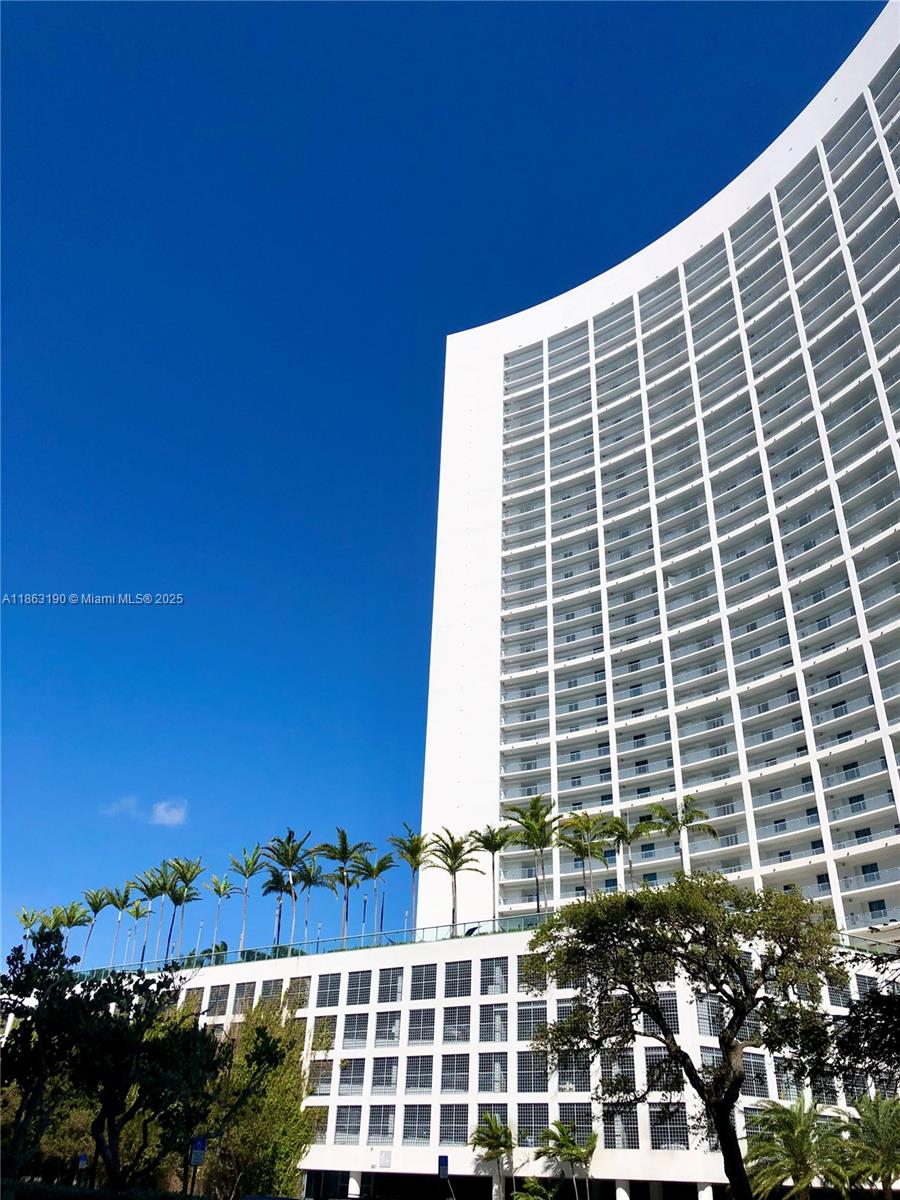 Breathtaking views of Biscayne Bay and Miami Beach from all rooms of this spectacular 1BR/1.5BA unit in Blue Condominiums. Feel like your living in a resort with full amenities: infinity-edge heated pool, hot tub, business center, game room, BBQ area, movie theater, gym, sauna, steam room, convenience store, valet and 24-hour concierge. Situated walking distance to Design District and Midtown shops / restaurants, across the causeway to Miami Beach and I-95 to the airport. Conveniently located to be 20 minutes from Brickell, Coconut Grove, Miami Beach, Aventura and Doral.