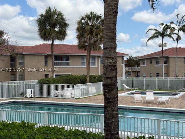 Photo of 922 Twin Lake Dr #922, Coral Springs, FL 33071 (MLS # A12025737)