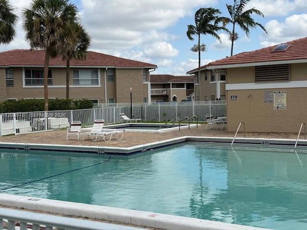 Photo of 922 Twin Lake Dr #922, Coral Springs, FL 33071 (MLS # A12025737)