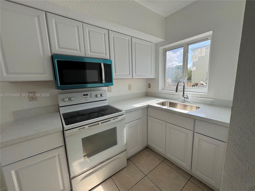 Welcome to this beautifully maintained corner-unit townhome. This spacious residence features 4 bedrooms and 3 bathrooms, offering comfort, functionality, and privacy. The home includes a bright living and dining area plus an additional family room, perfect for entertaining or relaxing. The remodeled kitchen offers modern finishes and excellent functionality, while ceramic flooring runs throughout the entire home. Upstairs, you’ll find generously sized bedrooms with ample closet space and well-appointed bathrooms. Additional storage includes multiple hallway closets and a spacious laundry area conveniently located under the stairs. Hurricane impact windows, and an in-unit washer and dryer add to the home’s convenience and value. Enjoy a large private fenced backyard with side gate access and the added privacy and natural light that come with being a corner unit. Easy to show!