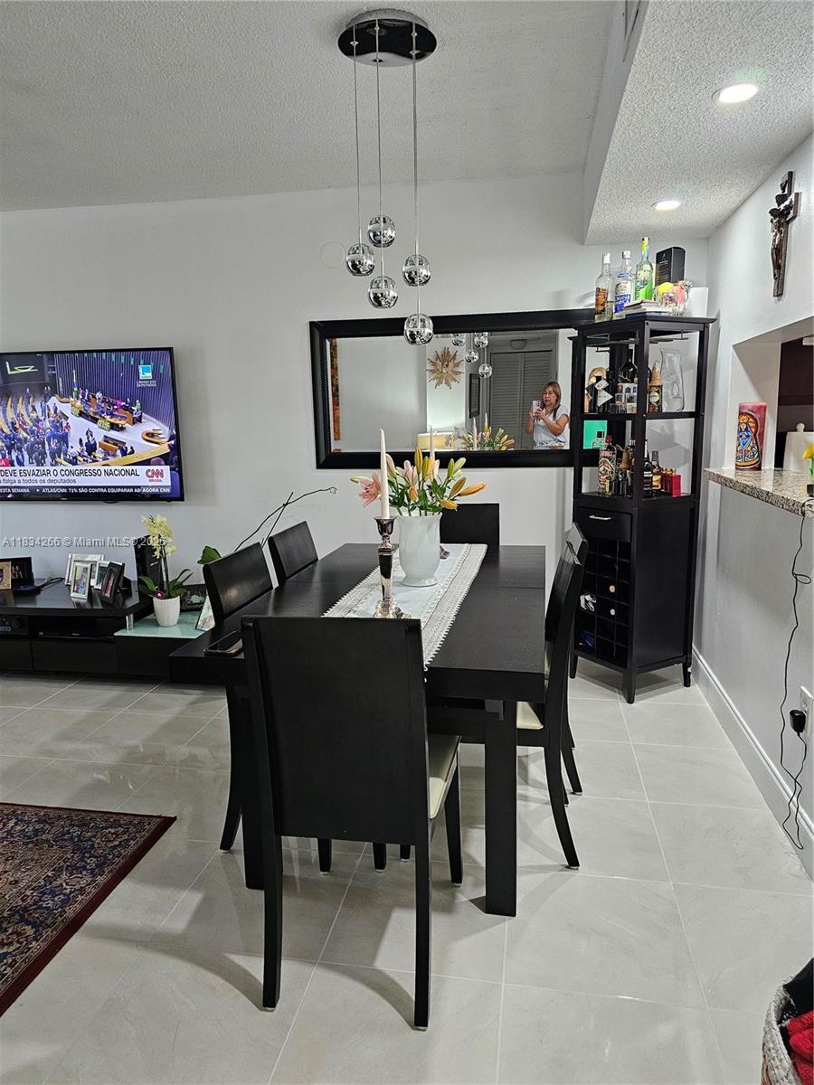 Excellent location! This apartment features 2 bedrooms and 2 bathrooms, with all furniture on the first floor. Enjoy a spacious screened-in balcony in a secure gated community with 2-hour security patrols. Ample storage includes closets and walk-in closets. Community amenities include pickleball, tennis, basketball, and racquetball courts, along with a swimming pool, clubhouse, and clubroom. This unit includes 1 assigned parking space and plenty of guest parking.